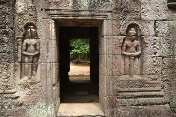 Fototapeta na wymiar Statues guarding temple gate at Angkor Complex Cambodia