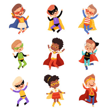 Set with cute kids superheroes. Joyful guys in superhero costumes jump and laugh