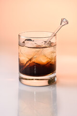 Black Russian Cocktail with vodka and coffee liquor and ice cubes 