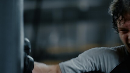 Progressive fighter training hits in fitness center. Kickboxer exercising at gym © stockbusters