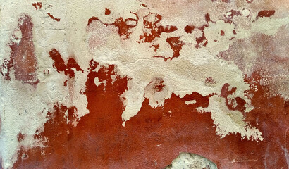 old white and red wall with peeling paint and chipped - rough and grunge texture for a background	