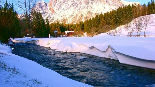 River near Green lake (Gruner see) in sunny winter day. Famous tourist destination for walking and trekking in Styria region, Austria