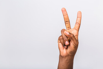Number two. Afro-American black man's hand showing different gestures isolated on white background, closeup view of hands.