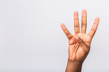 Number four. Afro-American black man's hand showing different gestures isolated on white background, closeup view of hands.