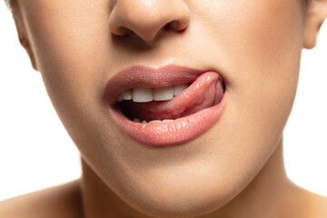 Attractive. Close-up shoot of beautiful female lips with natural lipstick make up. Beauty, fashion, skincare, cosmetics, ad concept. Copyspace. Well-kept skin and natural fresh look. Healthy shiny.