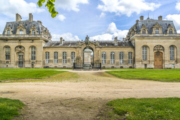 Fragments of old Chantilly Grand Stables near Chateau de Chantilly (Chantilly Castle, 1560) -...