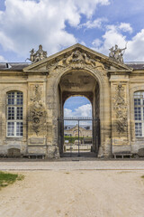 Fragments of old Chantilly Grand Stables near Chateau de Chantilly (Chantilly Castle, 1560) - historic chateau. Chantilly, Oise, Picardie, France.