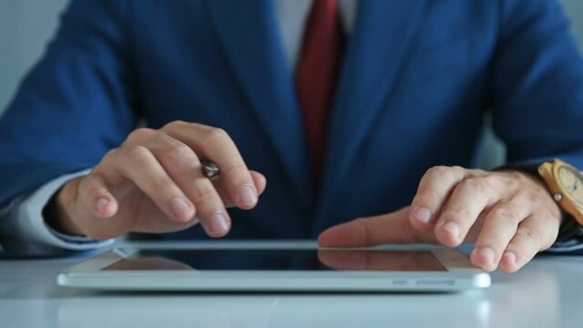 Close Up Of Hands Businessman Working On Tablet Computer. Occupation and worker concept. Close Up