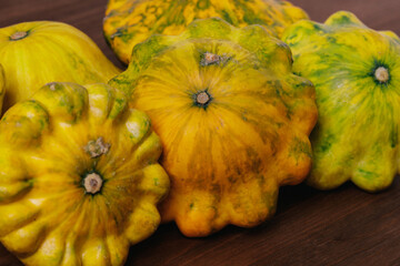 Colorful pattypan squash on wooden background. 