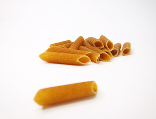 Tasty Italian pasta on white background. Wholegrain noodles.