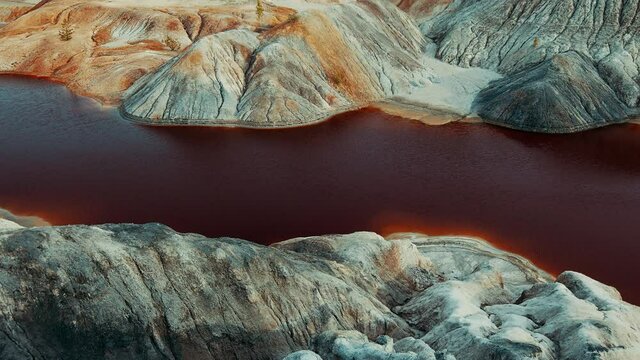 Martian landscape career in the Ural mountains. Bloody river. Fantastic view. The video can be used in cinema, reportage shooting, as a footage, in a music video
