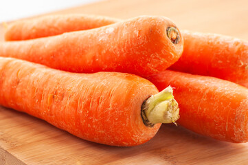 carrots close up on wooden board