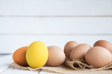 Eggs chicken on white wood background