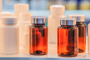 Advertising, Business, Cosmetics, Beauty Concept - Supplementary food Packages design. Glass and Plastic bottle with cap for vitamin, capsule and Blank packaging template for your design on the shelf.