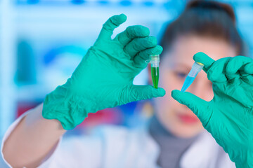 Young female laboratory assistant in laboratory analyzing environmental pollution