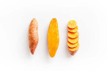 Set of whole and sliced sweet potatoes. Flat lay, top view