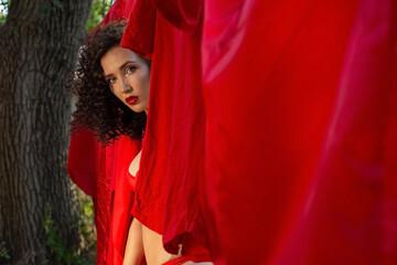 portrait of a beautiful brunette girl, in underwear, on the street. Beautiful young girl twenty six years old, nude