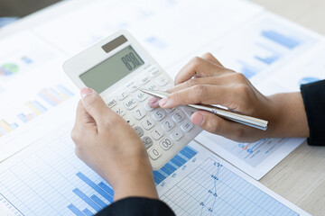 Young Asian women work in financial accounting in a private office at home.