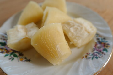 Steamed cassava served on a plate