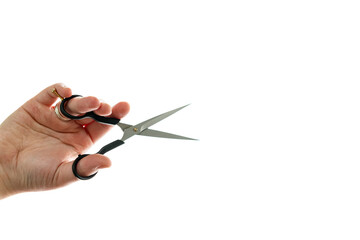 Close up of professional hairdresser holding scissors isolated on white background. Barber work tool - scissors on bright backdrop with space for text