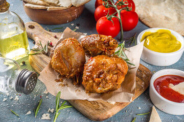 Roasted chicken legs or wings. Grill roasted spicy legs or wings,with various sauces and spices, copy space