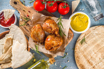 Roasted chicken legs or wings. Grill roasted spicy legs or wings,with various sauces and spices, copy space