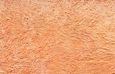 Texture of orange building plaster. Clay (concrete) textured pattern on the wall. Textured orange alabaster surface. Abstract bright background. - obrazy, fototapety, plakaty