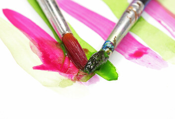 close-up brush and paint on colored background