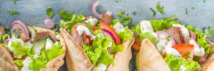 Turkish kebab wrap shawarma  sandwiches. Tasty fresh wrap sandwiches with beef meat and vegetables,...