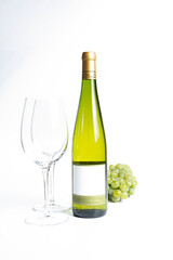 Bottle of white wine and glasses isolated on white