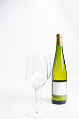 Bottle of white wine and glasses isolated on white
