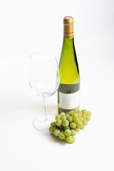 Obraz premium Bottle of white wine and glasses isolated on white