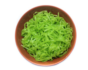 green noodles on bowl isolated on white background