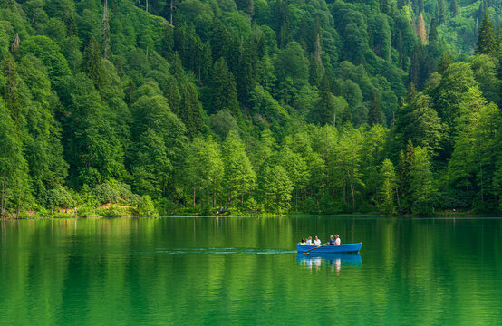 Artvin, Borcka/Turkey- June 05, 2019: Unidentified people rowing in a boat in Savsat Karagol Nature Park in Blacksea region.