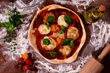 Handmade pizza mozzarella flat lay on the table with flour and decoration, very tasty