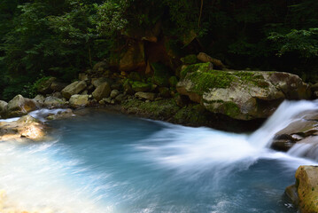 Fototapeta na wymiar Fantastic green and blue waterfall