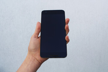 Hand holding a cell phone