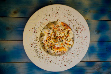 Ravioli on a porcelain plate, ravioli with sauce
