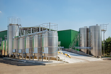 Big stainless steel reservoirs for the fermentation of wine.
