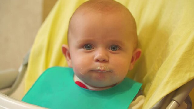 the baby is spoon-fed