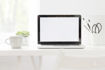 Laptop at trendy home office with white supplies, Homeschooling concept. Creative desk..