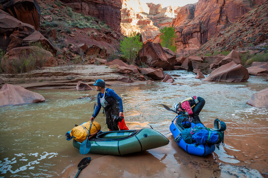 People check packrafts after boulder field on Escalante River, Utah