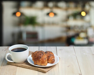 Croissant and coffee   on wood table