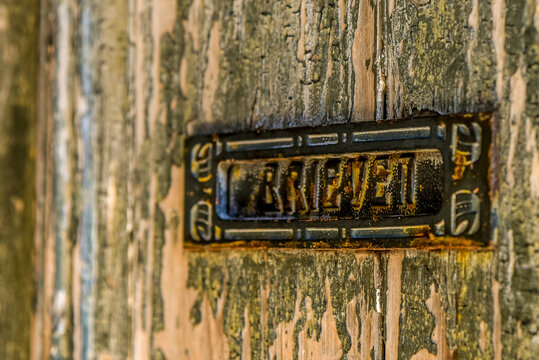 old mailbox in an old door.