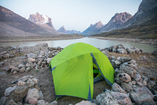 Camping tent perched above Summit Lake in Auyuittuq National Park