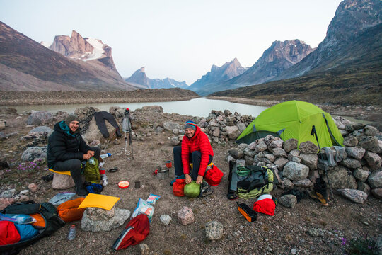 Two climbers at Summit Lake basecamp in Akshayak Pass, Baffin Island.