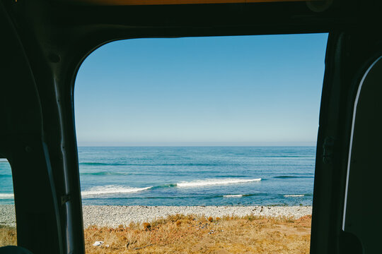View of ocean from door of a sprinter van in Baja, Mexico.