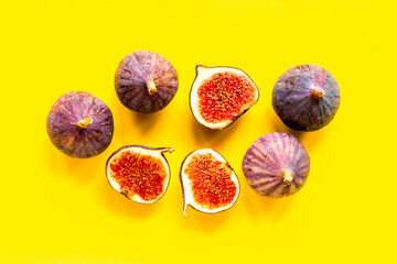 Pattern of whole and sliced figs. Overhead view