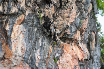 Granite marble rock structure surface of natural mountain's cliff and cave. 