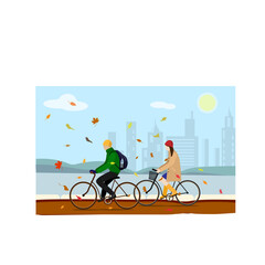 girl and guy ride bicycles in the park. autumn city and leaf fall. autumn clothes: coat, warm jacket and rubber boots